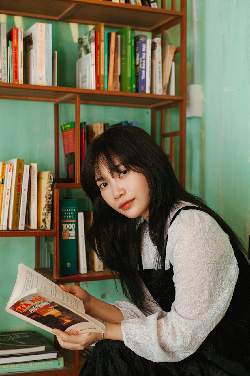 young woman reading in a hanoi cafe interior - Shooting Angle Tips